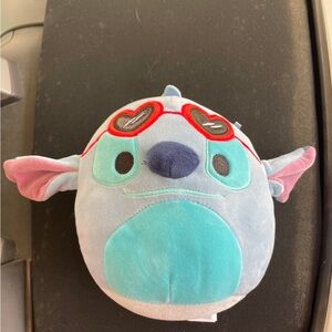 Blue and Pink Plush Toy with Red Glasses